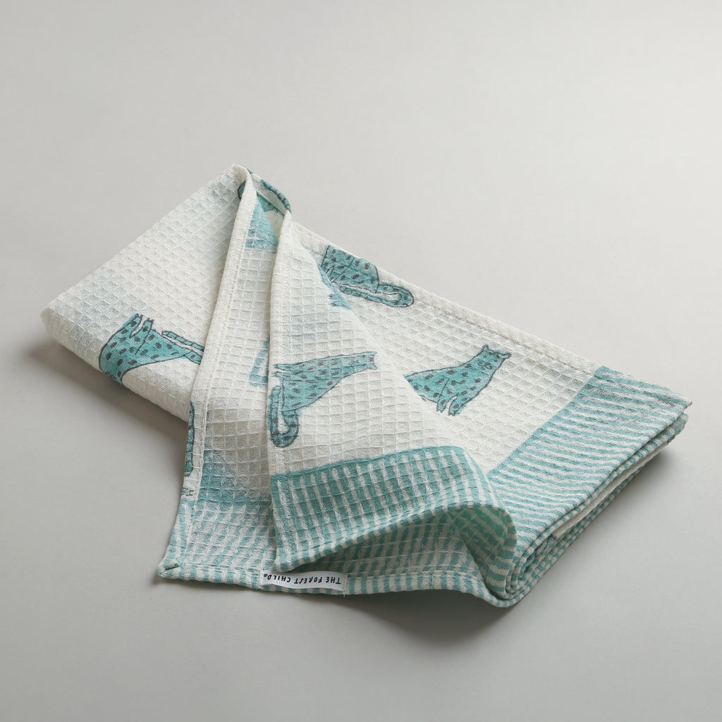 'A Leap of Snow Leopards' Bathing Towel