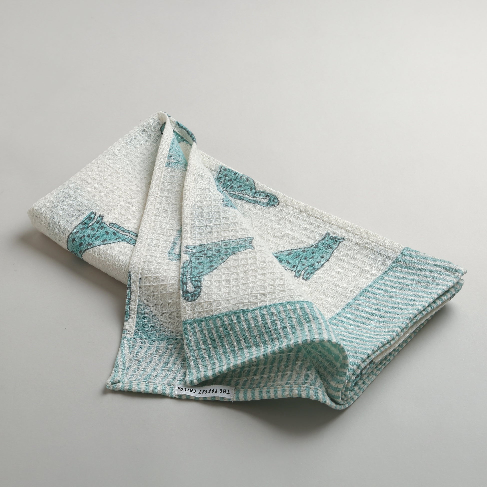 'A Leap of Snow Leopards' Bathing Towel